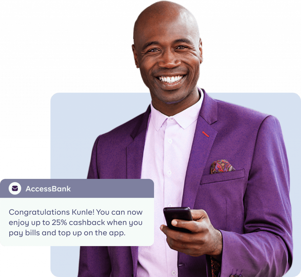 An image of a man receiving a message from his bank smiling